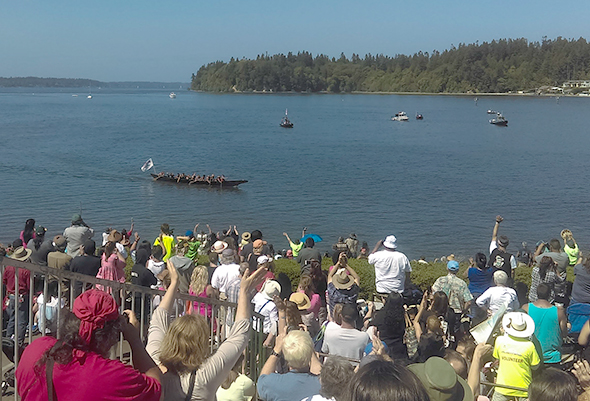 View of Canoes Coming Ashore in the Salish Sea